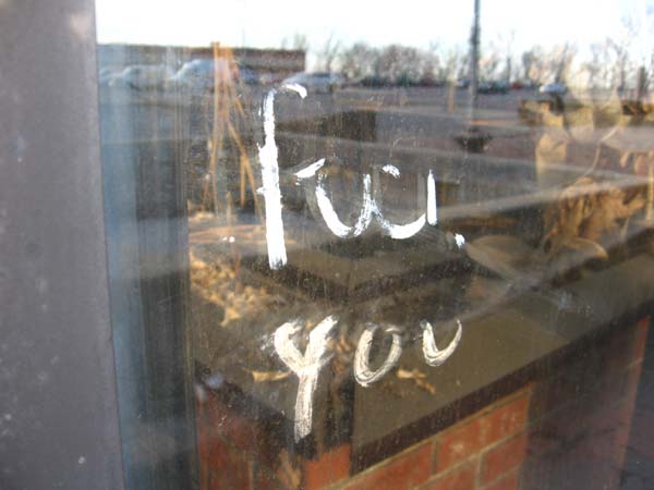 Even a parting sentiment painted on the window fades under the constant assault of time and the elements.