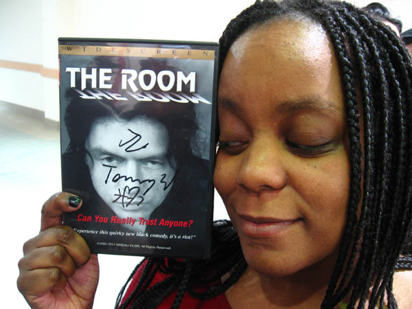 Cindy looks adoringly at her signed DVD. The ladies get an extra heart-and-arrow scribbling on their merchandise.